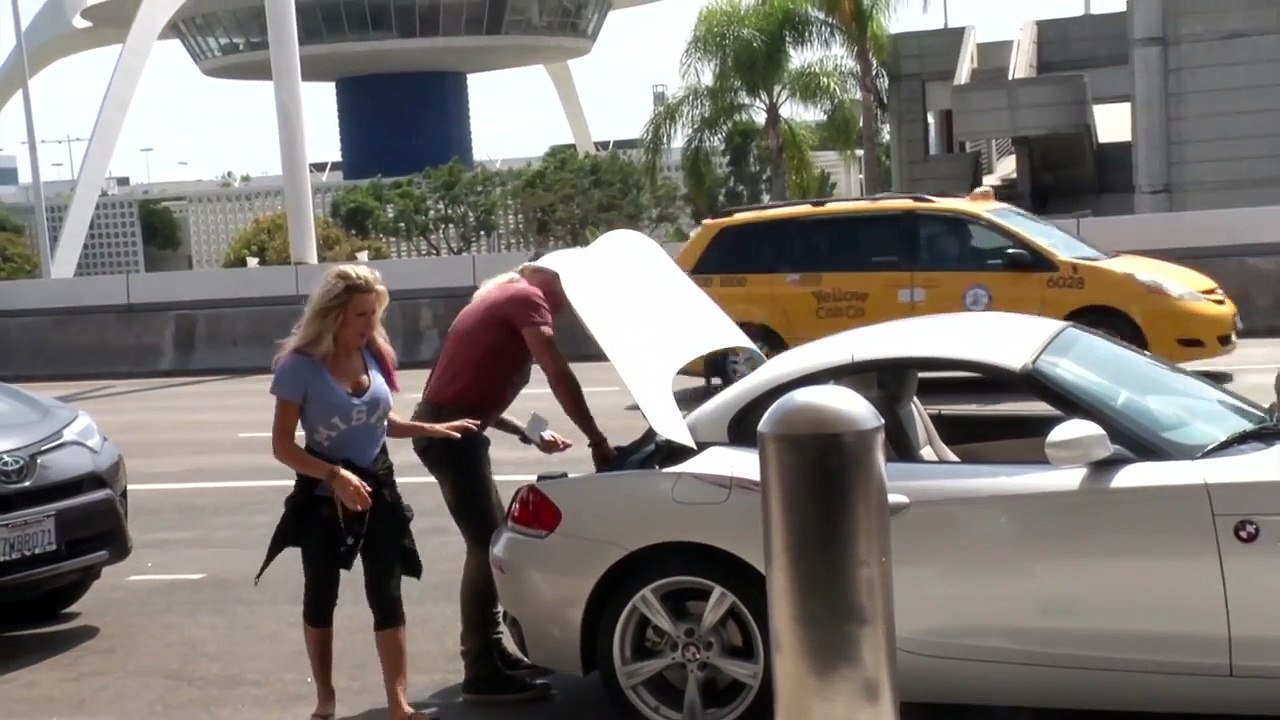 Twisted Sister's Dee Snider And Wife Suzette Hop Into Their BMW At LAX