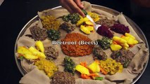 Ethiopian Food - Beyeyanetu a vegan platter of food on injera - miser gomen wot enjera sinig