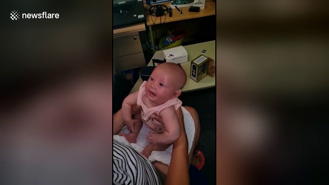 Deaf UK baby smiles when she hears family for the first time