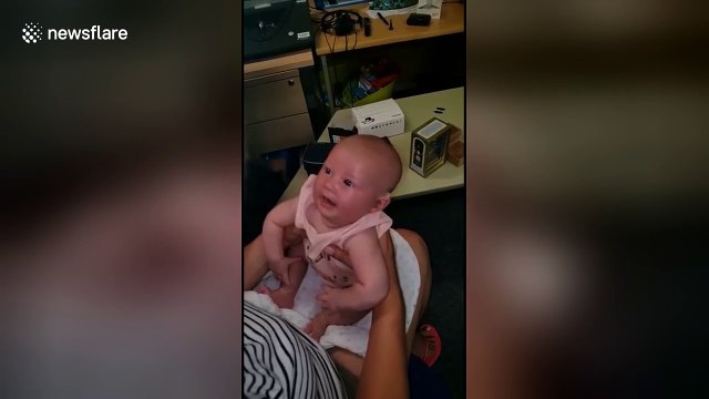 Deaf UK baby smiles when she hears family for the first time