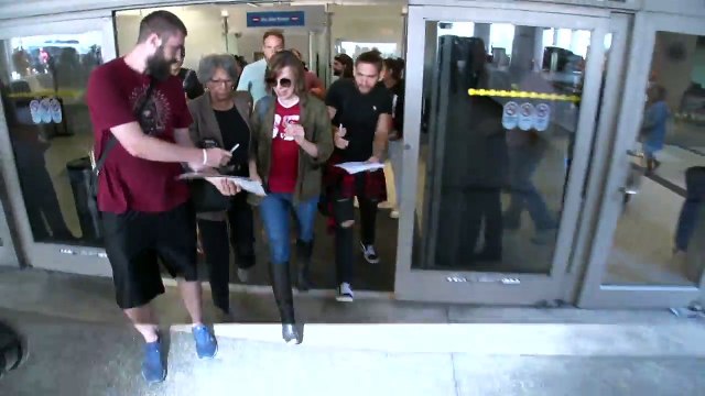 Supermodel Milla Jovovich Gets A Hollywood Welcome At LAX