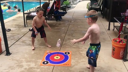 Kids bottle flip challenge at swimming pool