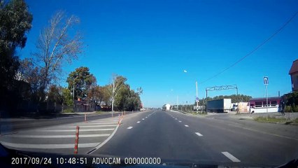 Truck Crashes into Passing Car