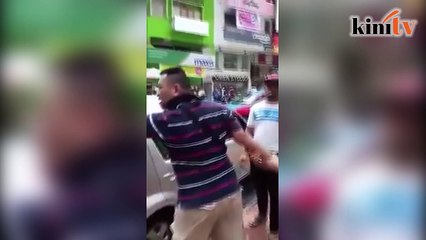 Man challenges DBKL officers to a fight over clamped car
