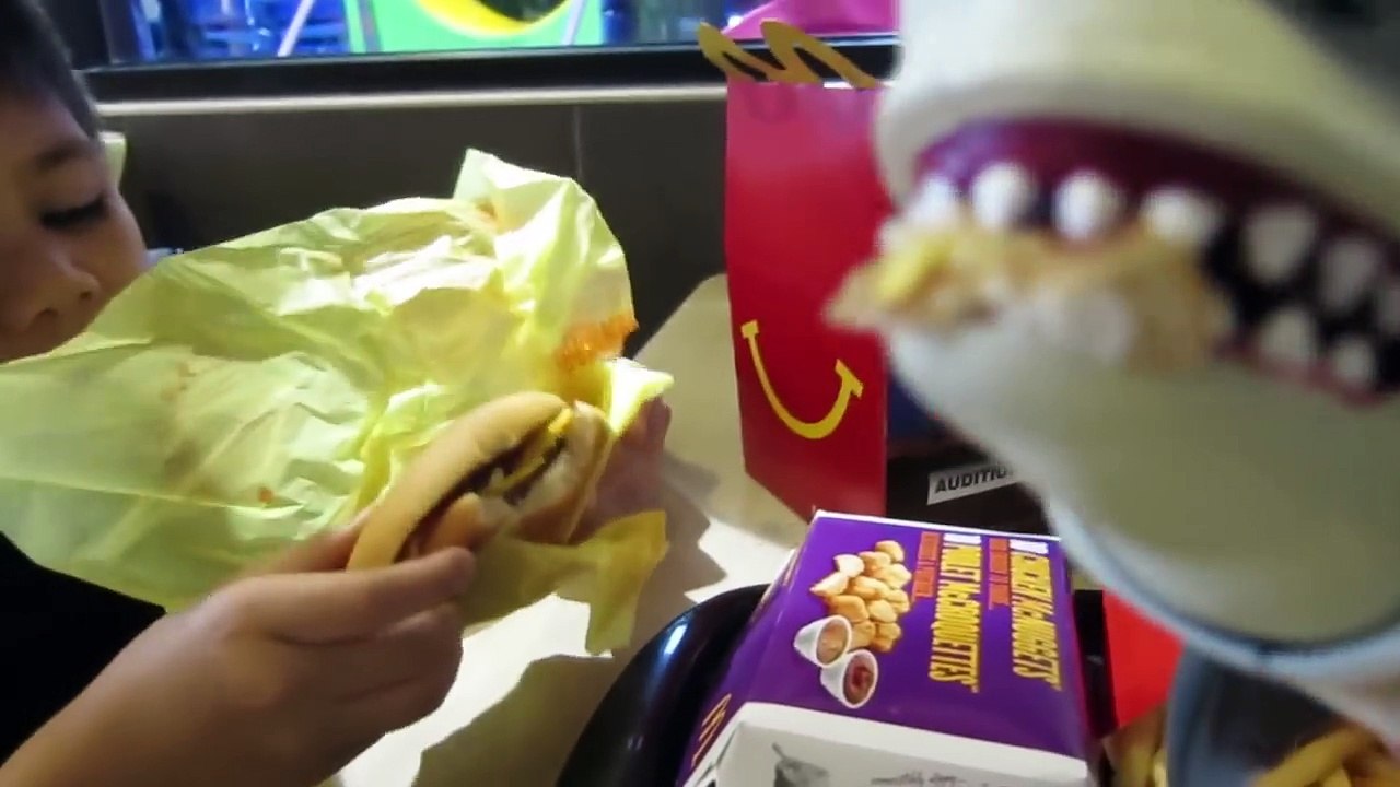 Pet Shark at McDonalds eats Chicken Nuggets Happy Meal Big Mac and Fries then goes to the Slide
