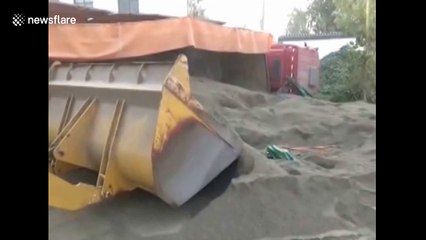 Lorry tips over onto scooter driver in China