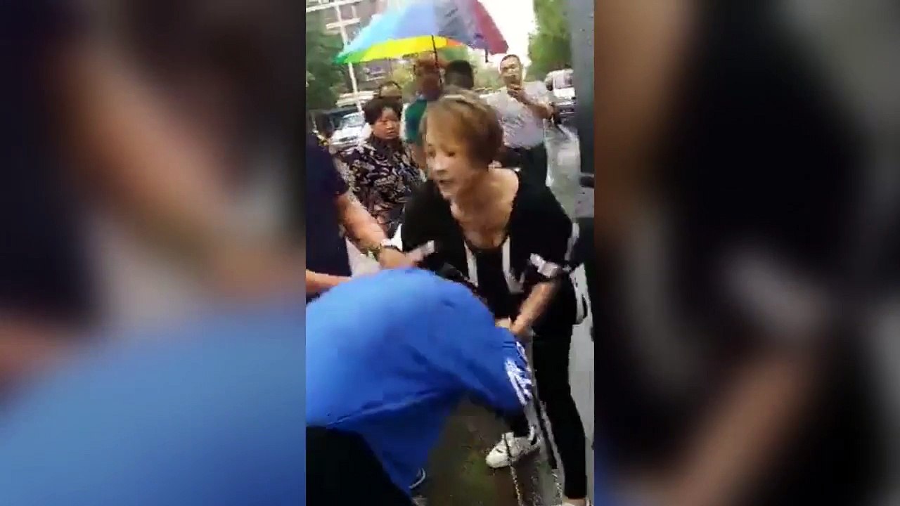 Wife drags husband's mistress out of his car and beats her
