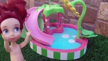 Elsa and Anna toddlers fun at the water park -swimming pool fun & slides with Ariel