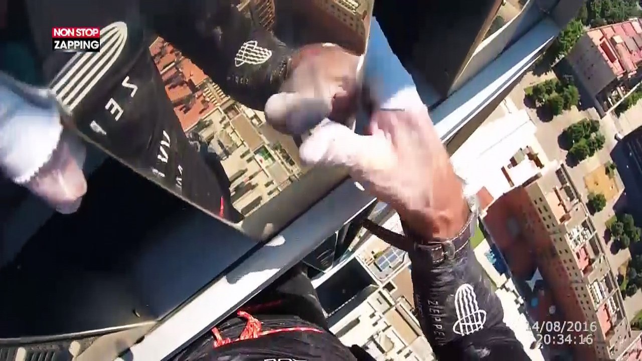 Alain Robert, le "Spider-man français" escalade une tour à Barcelone ! (vidéo)