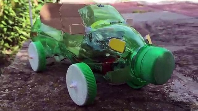 How to Make a Car Out of Plastic Bottle - (Powered Car/Electric Toy)