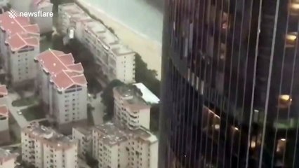 Window-cleaning cradle drops from skyscraper