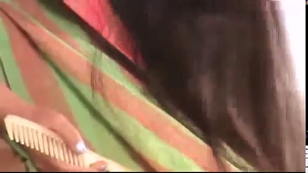 Indian long hair girl combing in sitting posture