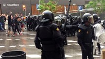 Barcelona residents drive back Spanish riot police
