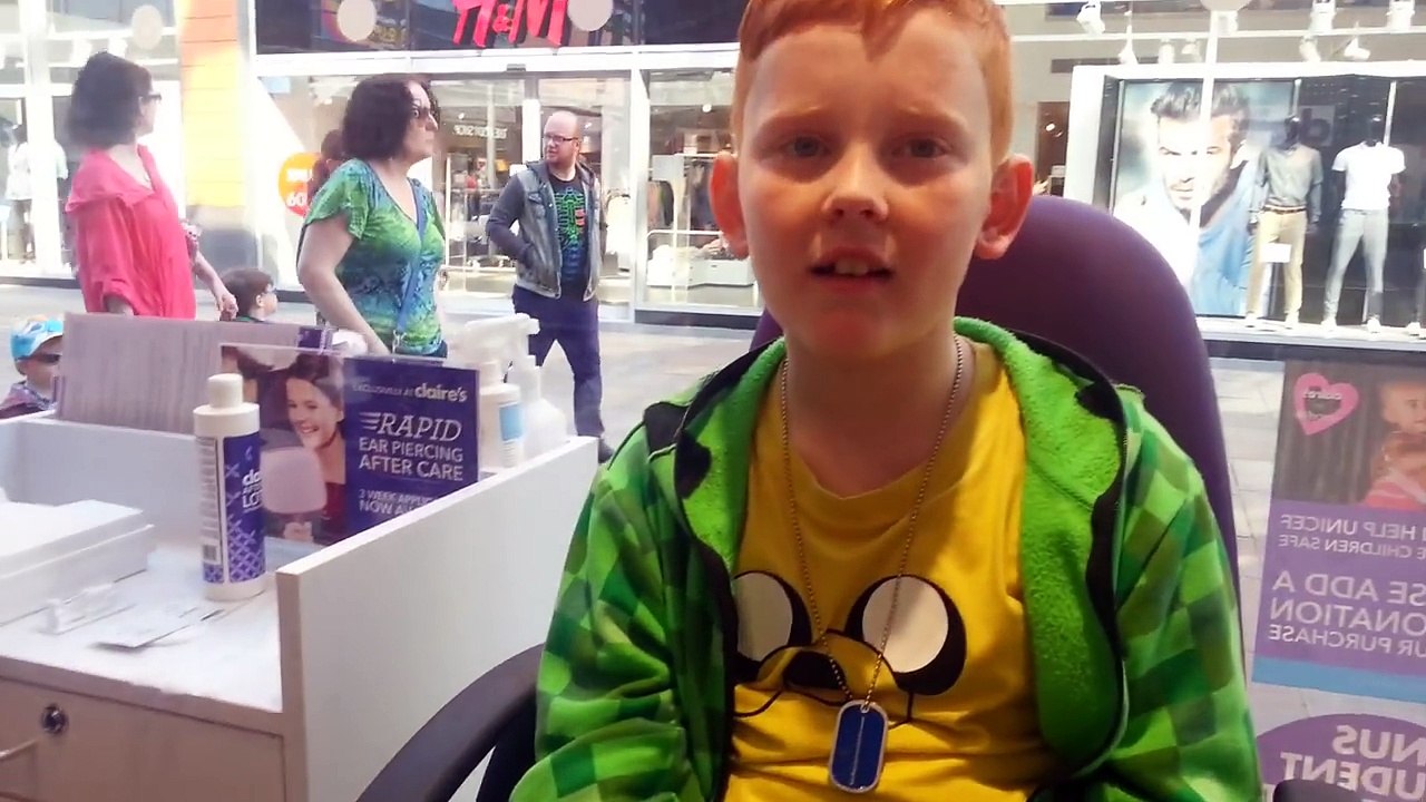 My son getting his ear pierced at Claires Accessories!