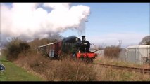 Steam Engine Starts Off Pulling a Goods Train