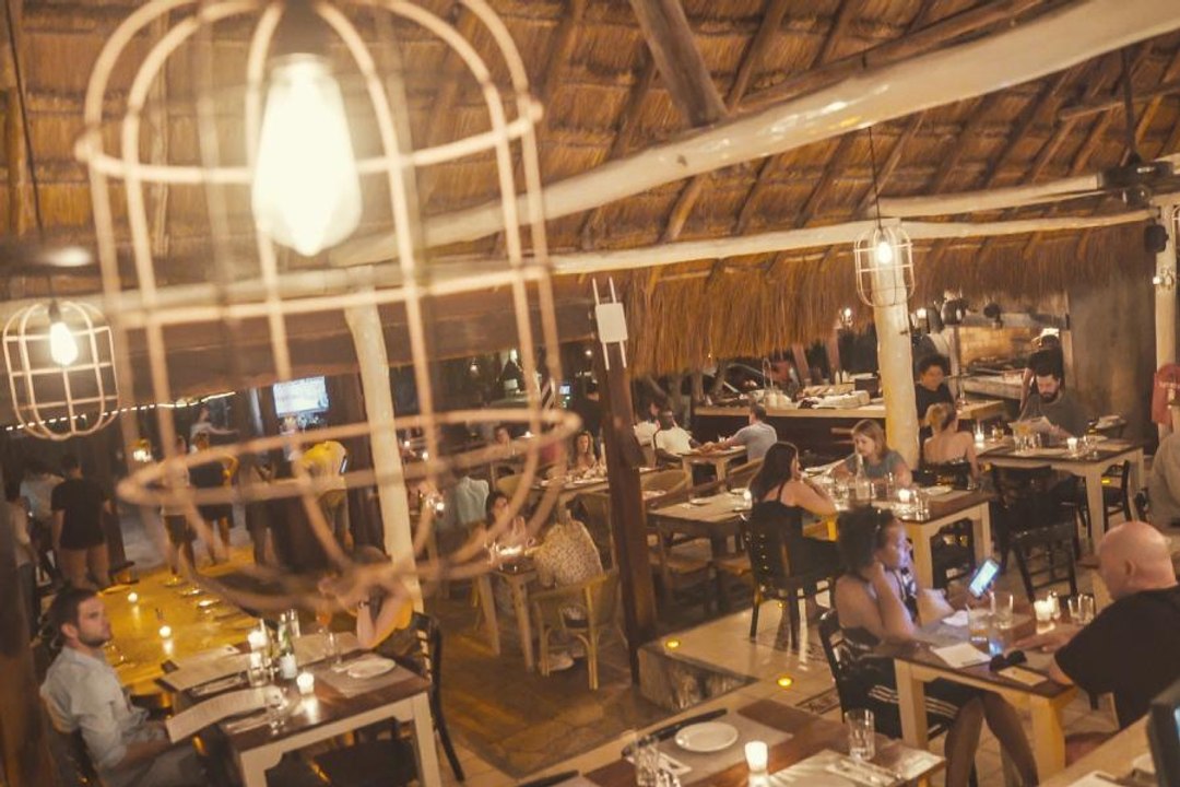 Ogle the massive cuts of beef charring over white hot logs