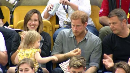 Sneaky toddler steals Prince Harry's popcorn