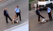 Antalya'da yerde yatan kadını tekmeyelen polisler açığa alındı