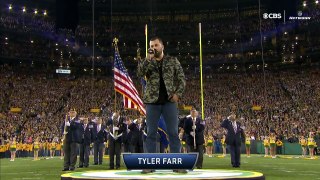 Players and coaches at Lambeau Field locked arms during the National Anthem.