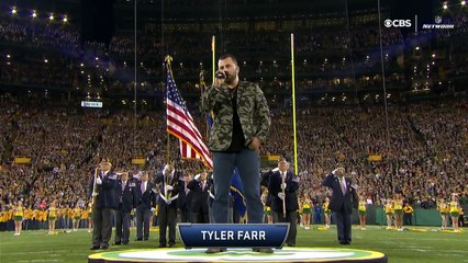 Players and coaches at Lambeau Field locked arms during the National Anthem.