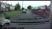 Bus overtakes on the wrong side of a traffic island narrowly avoiding collision