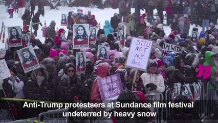 Heavy snow fails to put off anti-Trump protesters at Sundance