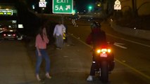 WATCH: Drunken woman wanders onto I-15 freeway