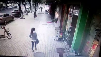 Unlucky pedestrian flattened by huge shop sign