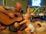 Baby rocks out with dad playing Bon Jovi