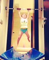 Toddler Performs Pull Ups on Exercise Bar