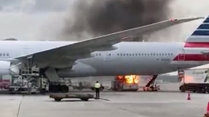 Fire breaks out next to American Airlines jet at Hong Kong airport