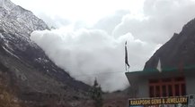 An Avalanche-Induced Snow Storm Slowly Barrels Towards A Town Before Blacking Out The Sky