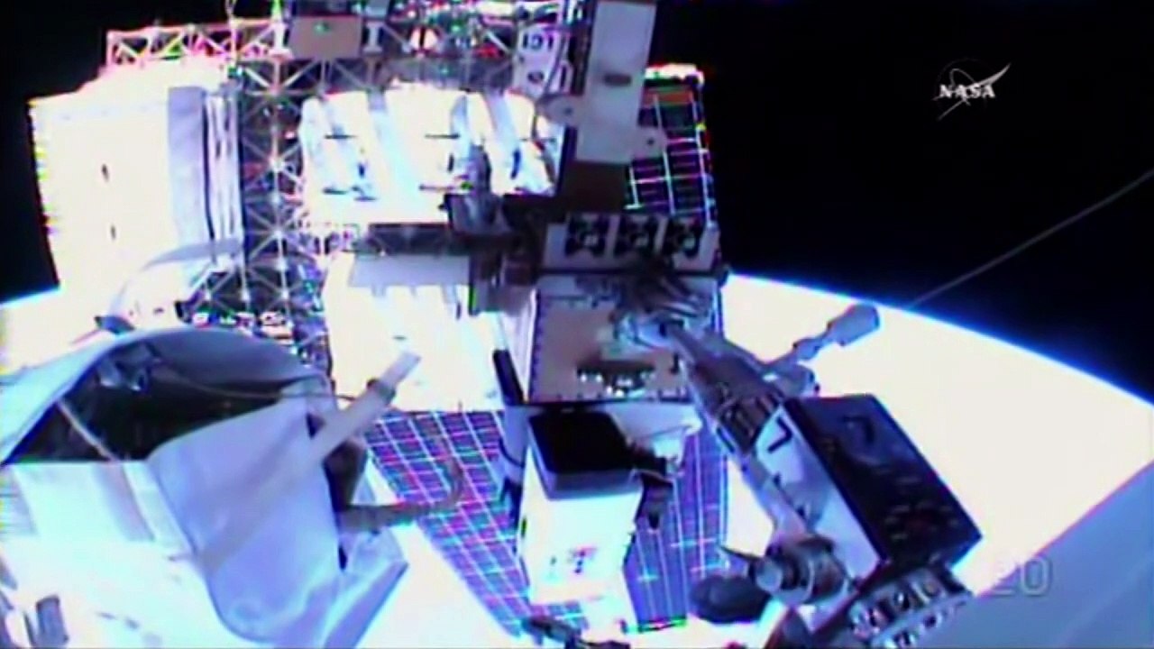 US spacewalkers float out to lubricate robotic arm