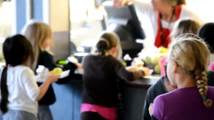 U.S. Airman Surprises His Daughter in the School Lunch Room