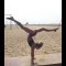 Very flexible girl on the beach