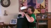 U.S. Navy Sailor Surprises His Grandmother While Posing for a Photograph