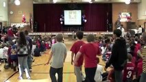 Soldier Suprises Children at Veterans Day Celebration