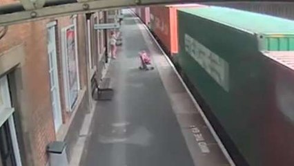 Stroller Gets Sucked Onto Tracks By Speeding Freight Train