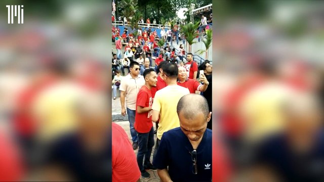 Mohamed Azmin Ali taking selfies with supporters at opposition rally