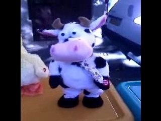 PELUCHE AUTOMATE VACHE DANSE ET DANDINE