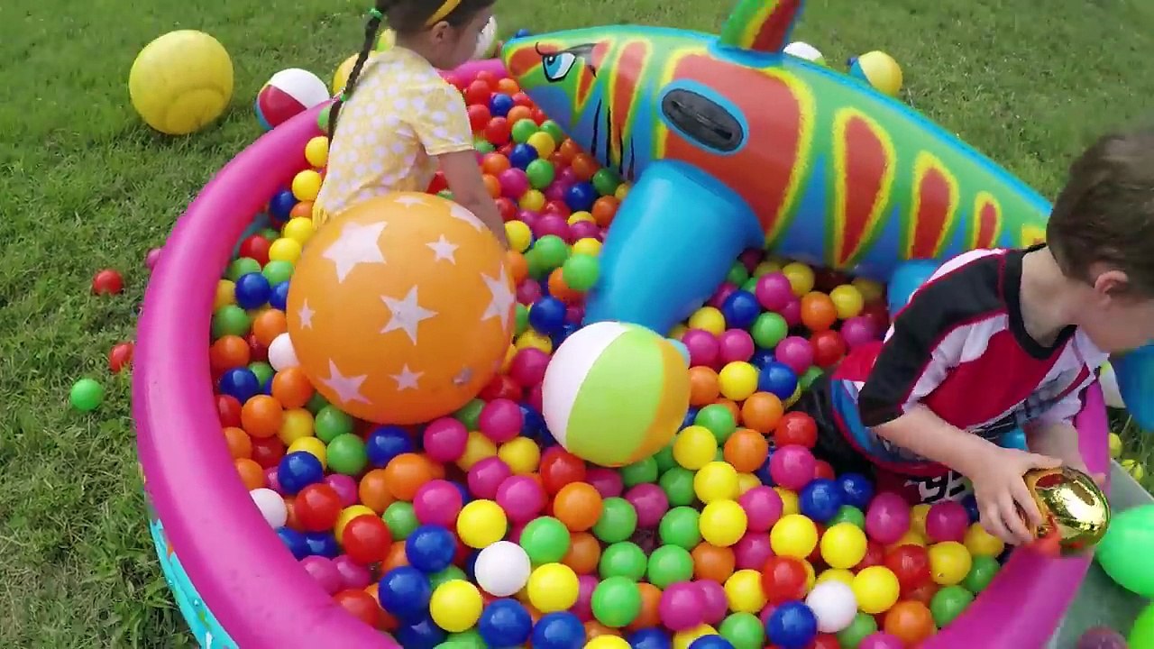 GIANT SURPRISE EGGS HUNT IN A KIDDIE POOL Big Egg Opening Golden Surprise Egg Balls Frozen Cars Toys