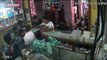 Shop employees run for cover as mobile phone explodes
