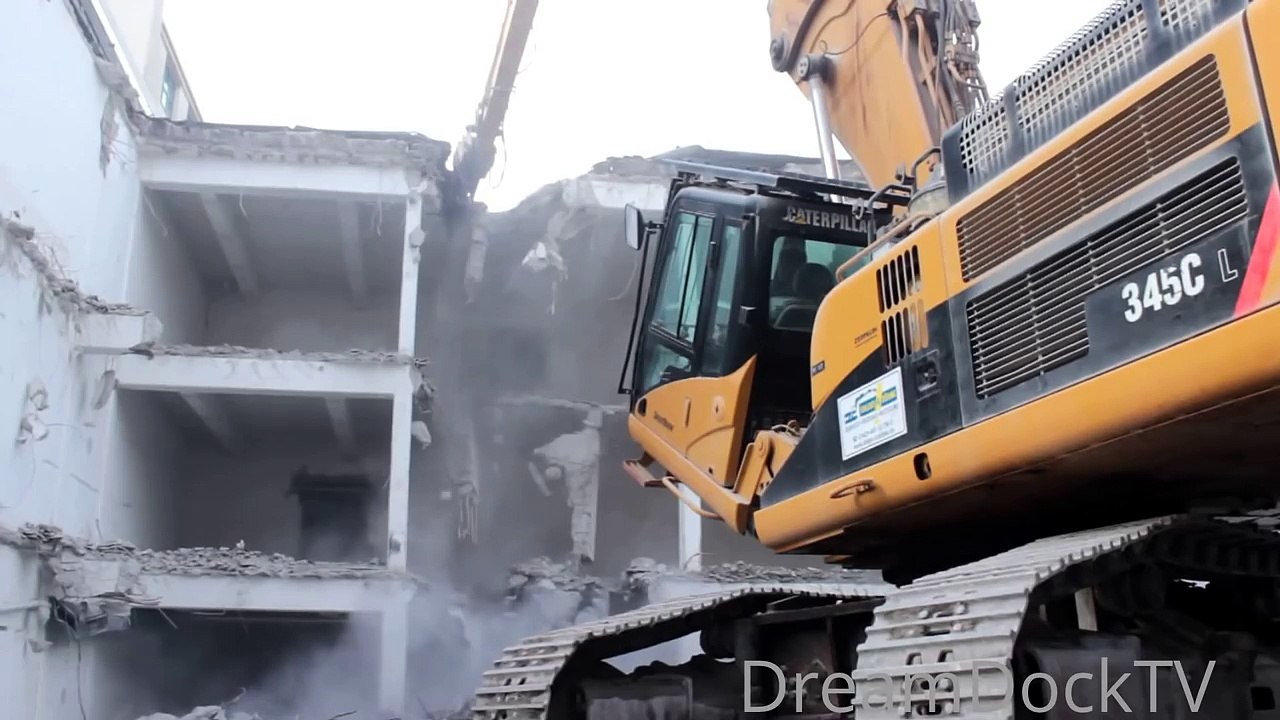 TEARING DOWN OLD SCHOOL BUILDING WITH CATERPILLAR 345C LONGFRONT EXCAVATOR