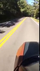 Guy skateboards outside his car down a hill and wrecks car!