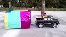 Hauling A Giant Box Toy Surprise Using His Power Wheels Ride On Chevy Truck And Custom Built Trailer