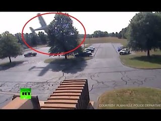 RAW: Moment plane crashes into tree in US parking lot caught on CCTV