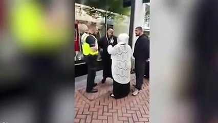 Angry Muslim Preacher tells UK policeman to: "Get out of his face" and the policeman does as he was told.