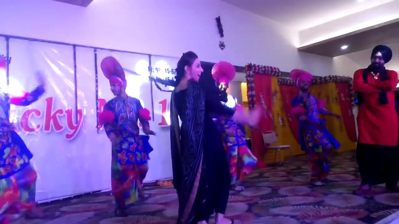 Tanu Brar With Gun On Stage