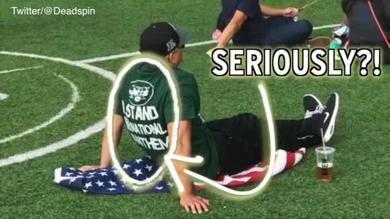 Is This Guy For Real? Jets Fan Stands For Anthem, Sits On Flag