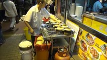Hong Kong Street Food. Cooking the Hot Pot. Mong Kok, Kowloon